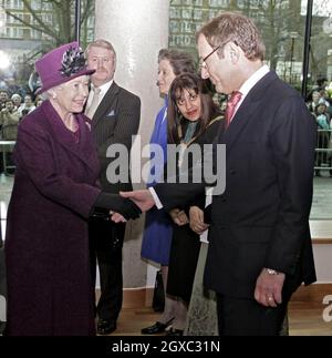 Queen Elizabeth II meets Express Newspapers owner Richard Desmond as she opened The Richard Desmond Children's Eye Centre at Moorfields Eye Hospital in London on February 23, 2007. Stock Photo