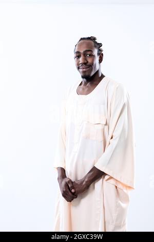 portrait of  handsome african black man in traditional islamic sudan fashion clothes isolated on white background Stock Photo