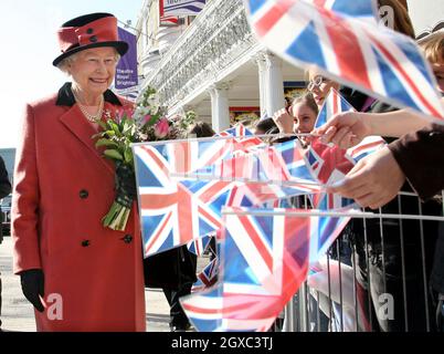 Queen Elizabeth ll is greeted by crowds waving Union Jack flags as she visits the Theatre Royal in Brighton to mark the 200th anniversary of the Theatre on March 8, 2007. Stock Photo