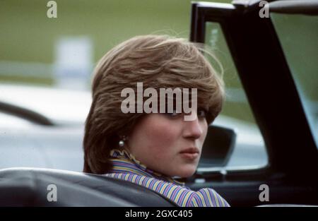 Lady Diana Spencer, soon to become the Princess of Wales, sits in a sports car after watching her future husband, Prince Charles, Prince of Wales play polo at Windsor Great Park in June, 1981. Stock Photo
