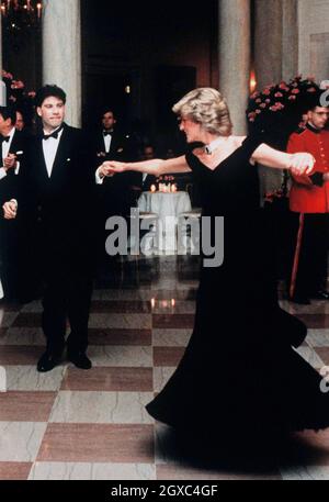 Diana, Princess of Wales dances with John Travolta at the White House, watched by President Ronald Reagan and his wife Nancy in November 9, 1985 in Washington DC. Stock Photo