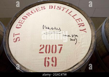 Prince Charles, Prince of Wales signs a barrel as he visits the English Whisky Company in Norfolk on March 27, 2007. Stock Photo