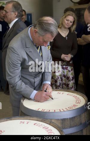 Prince Charles, Prince of Wales signs a barrel as he visits the English Whisky Company in Norfolk on March 27, 2007. Stock Photo