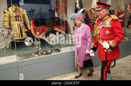 Queen Elizabeth ll looks at exhibits with Lord Guthrie, former Chief of Defence Staff, in the Household Cavalry Museum, at Horse Guards Parade, London as she attends the Household Cavalry Pageant. Stock Photo