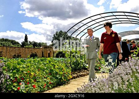 Prince Charles, Prince of Wales and head gardener Christine Brain tour the Gertrude Jekyll inspired Arts and Crafts Garden at Barrington Court in Barrington. Stock Photo