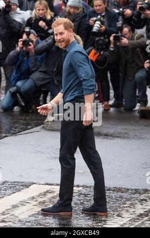 Prince Harry, Duke of Sussex crosses the iconic Abbey Road zebra crossing at the Abbey Road Studios in London where a single has been recorded for the Invictus Games Foundation on February 28, 2020 Stock Photo