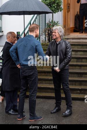 American singer songwriter Jon Bon Jovi greets Prince Harry, Duke of Sussex at the Abbey Road Studios in London for the recording of a single in aid of the Invictus Games Foundation on February 28, 2020. Stock Photo