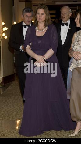 Sarah Brown, followed by her husband, Prime Minister Gordon Brown, arrives for the Commonwealth Heads of Government Banquet in Kampala, Uganda Stock Photo
