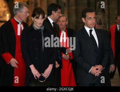 French President Nicolas Sarkozy stands with his wife Carla Bruni-Sarkozy during a visit to Westminster Abbey in London where he laid a wreath on the tomb of the unknown soldier during the first day of their state visit to the UK. Stock Photo