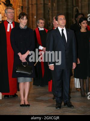 French President Nicolas Sarkozy stands with his wife Carla Bruni-Sarkozy during a visit to Westminster Abbey in London where he laid a wreath on the tomb of the unknown soldier during the first day of their state visit to the UK. Stock Photo