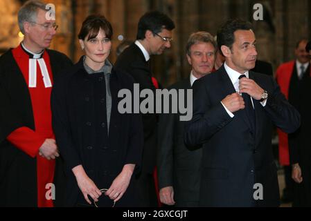 French President Nicolas Sarkozy stands with his wife Carla Bruni-Sarkozy during a visit to Westminster Abbey in London where he laid a wreath on the tomb of the unknown soldier during the first day of their state visit to the UK. Stock Photo