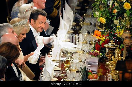 French President Nicolas Sarkozy enjoys the state banquet at Windsor Castle in Windsor, England. President Sarkozy and Carla Bruni-Sarkozy are on a two day state visit to the United Kingdom, comprising events in London and Windsor. Stock Photo