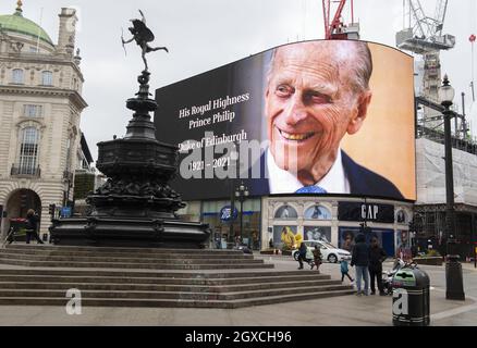 A tribute to Prince Philip is displayed on a large screen in Piccadilly Circus, London following the announcement that Prince Philip, Duke of Edinburgh had died on April 09, 2021.   Stock Photo