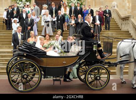 Peter Phillips and Autumn Kelly leave St. George's Chapel by horse drawn carriage after their marriage ceremony at Windor Castle, Windsor. Stock Photo