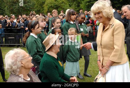 Camilla, Duchess of Cornwall meets elderly women who have tended the 'Dig for Victory' organic allotment in St James' Park, London, England. The Duchess of Cornwall was celebrating her 61st Birthday. Stock Photo