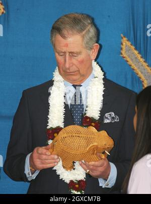 Prince Charles, Prince of Wales holds an elephant gift given to him to celebrate the Hindu festival of Holi during a visit to the Swaminarayan School in London, England. Stock Photo