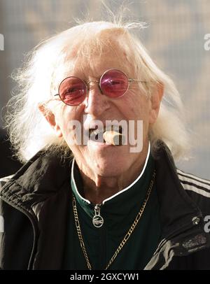 Sir Jimmy Savile attends the ceremony to name Cunard's new cruise-liner Queen Elizabeth II in Southampton Docks in Southampton, England. Stock Photo