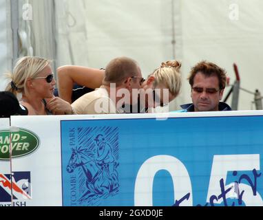 File photo of Zara Phillips and Mike Tindall. The Queen's granddaughter Zara Phillips has got engaged to long-term boyfriend Mike Tindall, Buckingham Palace said today, December 21, 2010.   TETBURY, ENGLAND - AUGUST 7: Zara Phillips, daughter of Princess Anne, chats to boyfriend Mike Tindall on the third day of the Gatcombe Park Festival of British Eventing at Gatcombe Park, on August 7, 2005 near Tetbury, England. (Photo by Anwar Hussein) Stock Photo