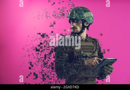 soldier using tablet computer hands closeup pnk background Stock Photo