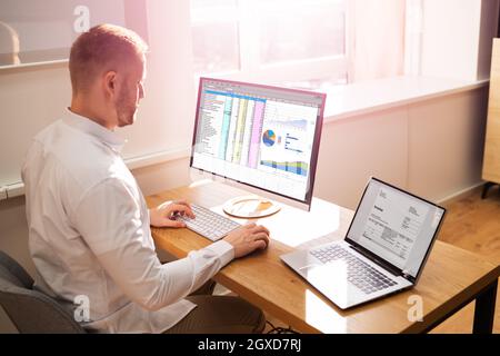 Spreadsheet Analyst Employee Worker. Medical Report On Computer Stock Photo