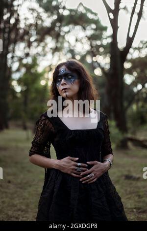 Beautiful mysterious mystical girl with long hair in black dress