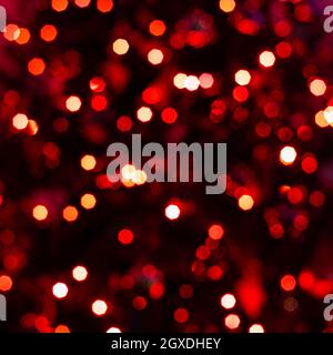 Various blurry red lights on black background. Stock Photo