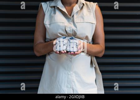 Unrecognizable crop female with smartphone and plastic card making payment and shopping online Stock Photo