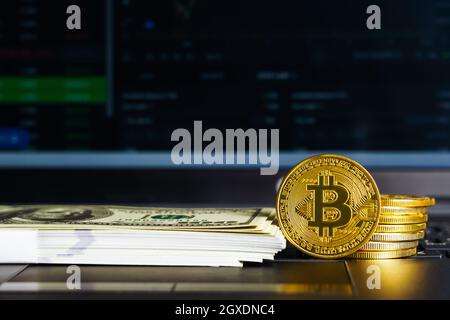 Bitcoins coin and banknotes on keyboard computer. Close up of  bitcoin crypto currency coins Stock Photo
