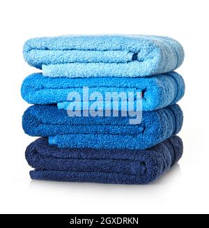Folded stack of towels on white background Stock Photo