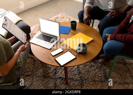 African american senior couple meeting with asian financial advisor using laptop with copy space Stock Photo