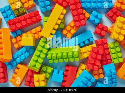 Plastic toy blocks on blue background Stock Photo