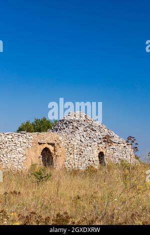 Trulli, typical houses near Castel del Monte, Apulia region, Italy Stock Photo