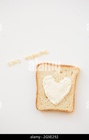 sandwich for breakfast in the form of heart with cheese - good morning inscription Stock Photo