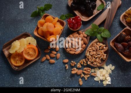 Mix of dried and sun-dried fruits,  in a wooden trays . View from above. Symbols of the Jewish holiday of Tu BiShvat Stock Photo