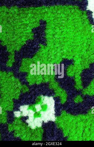Hand woven carpet pattern, close up view. Stock Photo