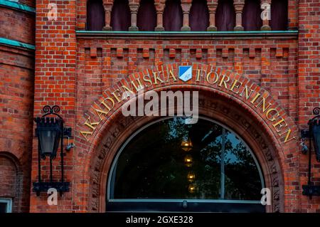 AF akademiska foreningen meaning academic association logo and title wtitten above the glass window on the brick facade of the student house famous la Stock Photo