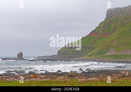 Rugged Cliffs on a Foggy Coast in Northern Ireland near the Giants Causeway Stock Photo