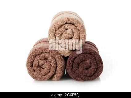 Rolled towels on white background Stock Photo
