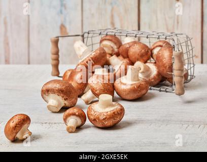 Beautiful farm mushrooms on wooden table Stock Photo