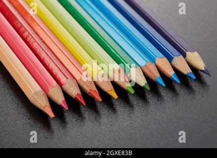 Multi-colored pencils on black background Stock Photo