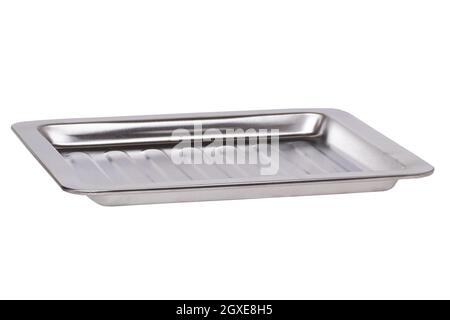 Closeup of an empty baking tray for the oven or a metal food container in the catering industry for storing food isolated on a white background. Macro Stock Photo