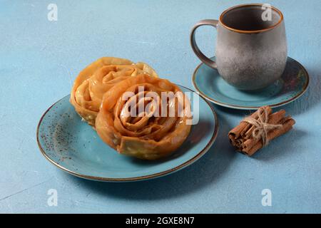 Fresh baked chebakia for ramadan. Chebakia moroccan pastries. Made of strips of dough rolled to resemble a rose, deep-fried until golden, then coated Stock Photo