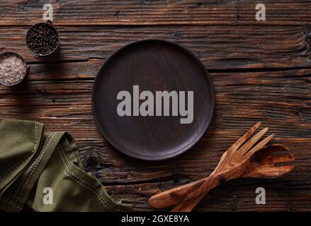 Empty plate on wooden table Stock Photo