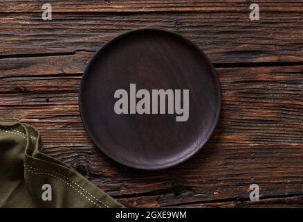 Empty plate on wooden table Stock Photo