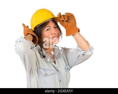 Attractive Smiling Hispanic Woman Wearing Hard Hat, Goggles and Leather Work Gloves Isolated on a White Background. Stock Photo