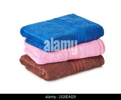 Folded stack of towels on white background Stock Photo