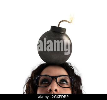 Businesswoman stunned by strong headache with a big bomb over the head. Isolated on white background Stock Photo