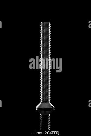 Metal bolt and nut on black background Stock Photo