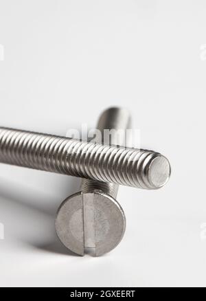 Metal bolts close-up on white background Stock Photo