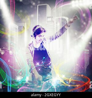 Boy dj mixes the music at party Stock Photo